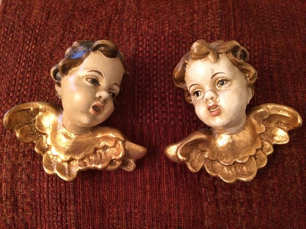 A pair of antique German gilded cherubs